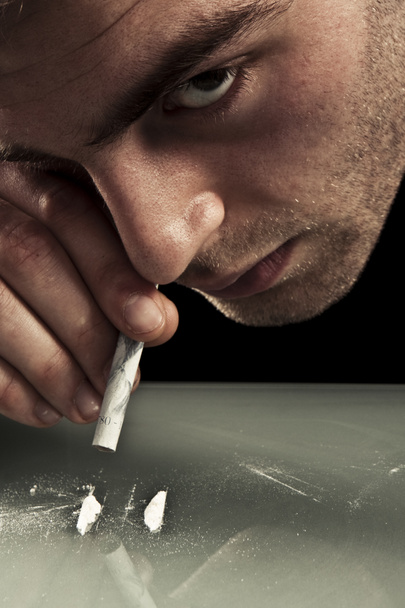 Young man sniffing cocaine. - Photo, Image