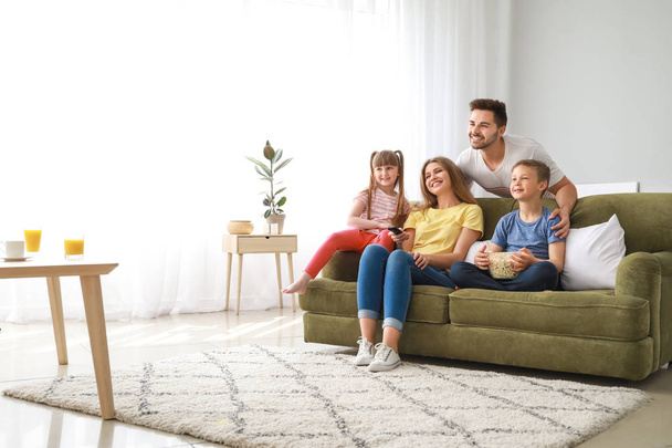 Happy family watching TV at home - Foto, Imagem