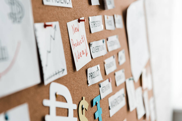 selective focus of papers with lettering on notice board - Photo, Image