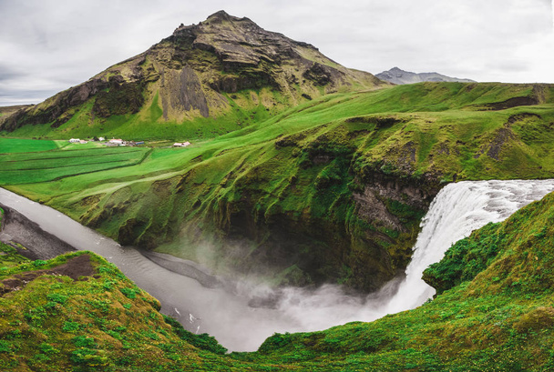 Green mountain view from top of Skogafoss Iceland famous waterfa - Фото, изображение