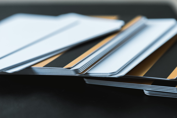 selective focus of stack with credit cards on black  - Foto, Imagem