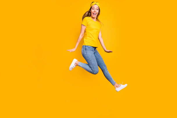 Full body photo of beautiful lady jumping high wear casual clothes isolated yellow background - Foto, immagini