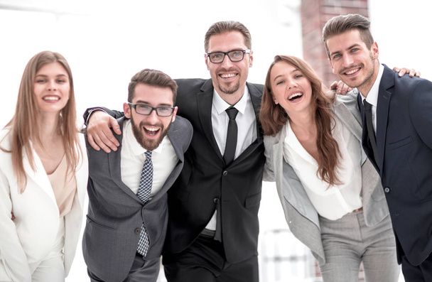 cheerful business team standing in the office - 写真・画像