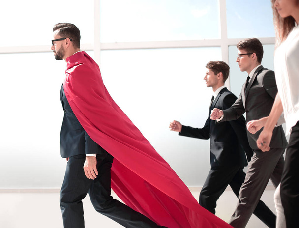 businessman superhero and his business team walking in office - Photo, Image