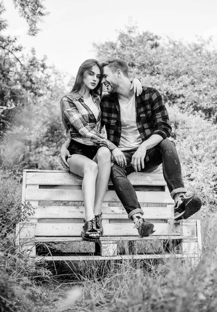 Expressing feelings. valentines day. summer camping in forest. man with girl in park. couple relax outdoor on bench. Relations. family rancho weekend. romantic date. couple in love. Checkered fashion - Zdjęcie, obraz