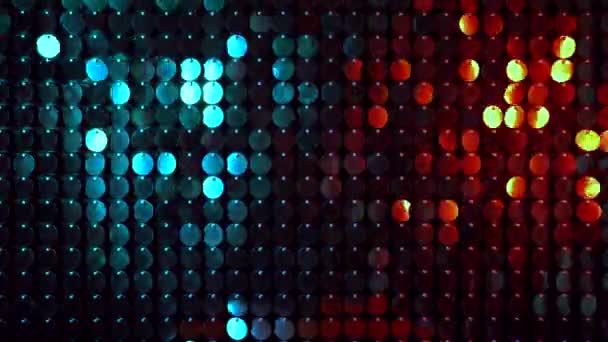 Shiny kinetic surface panel illuminated by gold and turquoise light in luxury boutique. Flickering background for interruptions or text savers. Mirror sequins sway by wind blowing. - Footage, Video