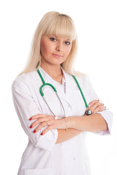 Nurse in a white coat with a stethoscope arms crossed. - Foto, immagini