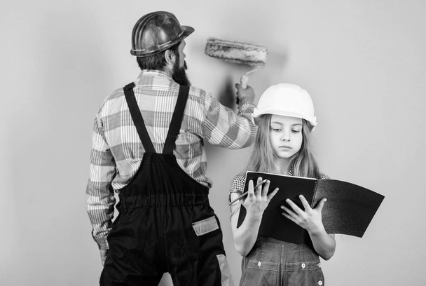 daughter and father repairing together in workshop. Family. Industry. Tools for repair. Fatherhood. man with little girl. engineering education. construction worker assistant. Confident professional - Photo, Image