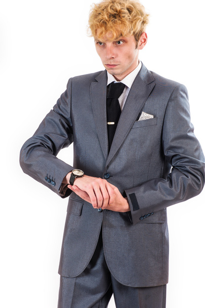 Hombre de negocios mira comprobado el reloj
 - Foto, Imagen