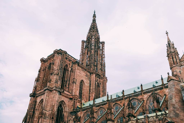 Low angle shot of the Strasbourg Cathedral or the Cathedral of Our Lady of Strasbourg - Photo, image