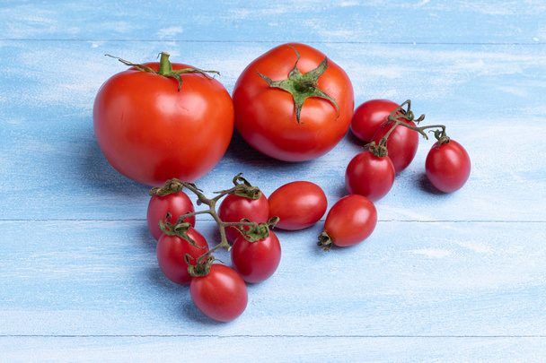 Fresh Tomatoes on wooden background - Fotó, kép