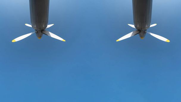 Two airplane propeller of military aircraft, copy space. Blue sky background. - Photo, Image