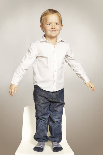 Cute young  three years old boy posing in studio for portrait - Foto, immagini