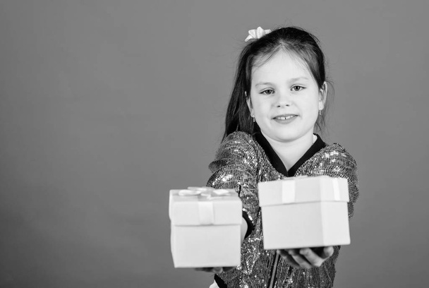 Girl with gift boxes blue background. Black friday. Shopping day. Cute child carry gift boxes. Surprise gift box. Birthday wish list. World of happiness. Special happens every day. Choose one - Фото, изображение