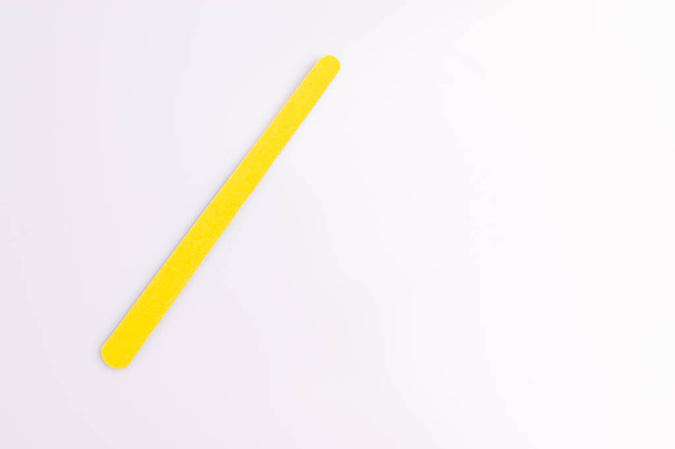 Yellow nail file isolated on white background - Photo, Image