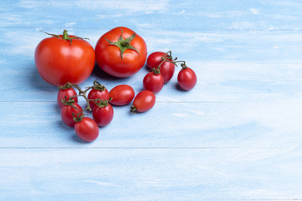 Fresh Tomatoes on wooden background - Photo, image
