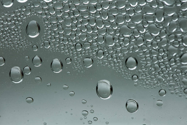 Νερό σταγόνες μακρο από ένα πλαστικό μπουκάλι 50 MP  - Φωτογραφία, εικόνα