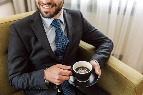 Attractive young businessman wearing suit - Foto, Imagen