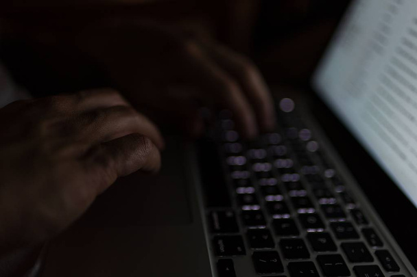 Closeup shot of a person typing on a computer keyboard - Zdjęcie, obraz