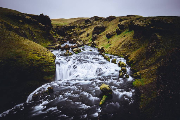 A beautiful river with a strong current in Skógafoss, Iceland - 写真・画像