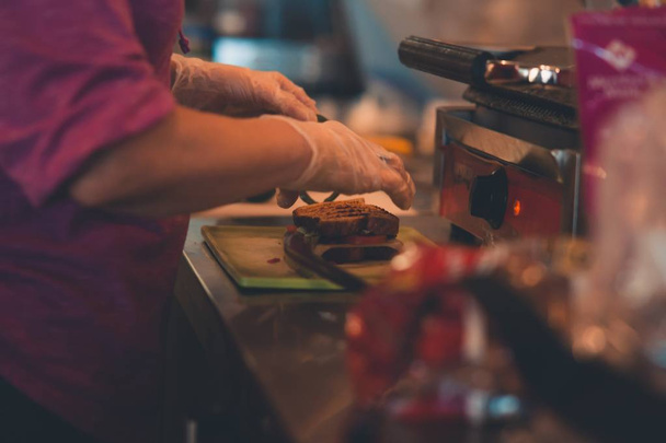Closeup shot of a person making sandwich in the kitchen - 写真・画像