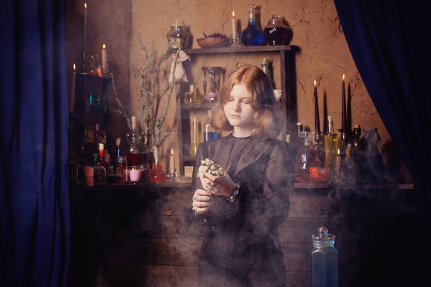 young witch in home. Halloween concept - Fotografie, Obrázek