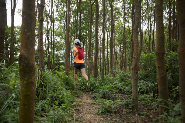 Ultramarathon runner running in tropical rainforest - Фото, изображение