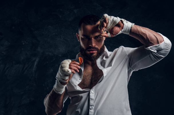 Portrait of handsome bearded man in boxing gloves - Photo, Image