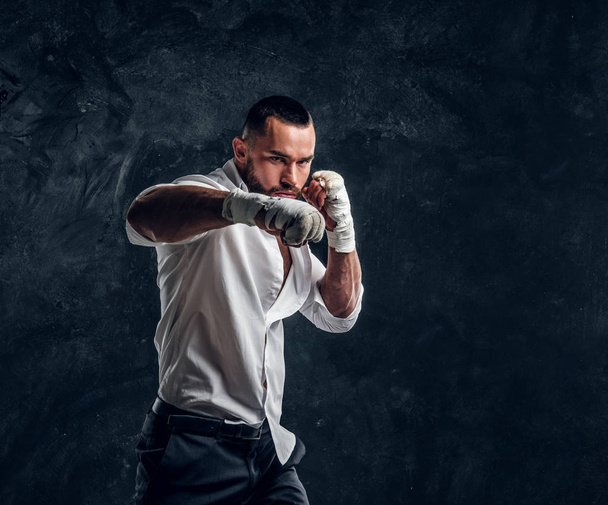 Portrait of handsome bearded man in boxing gloves - Photo, Image