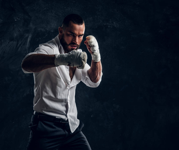 Portrait of handsome bearded man in boxing gloves - Fotoğraf, Görsel
