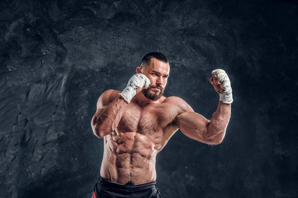 Portrait of muscular fighter with nacked torso - Photo, image
