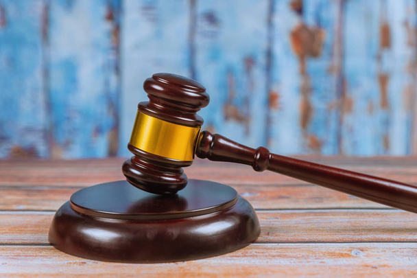 Wooden judge gavel isolated on wooden background. - Photo, Image