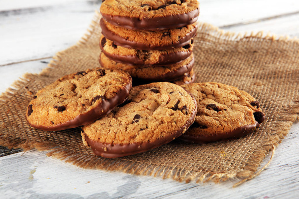 Chocolate cookies on wooden table. Chocolate chip cookies shot o - Photo, Image