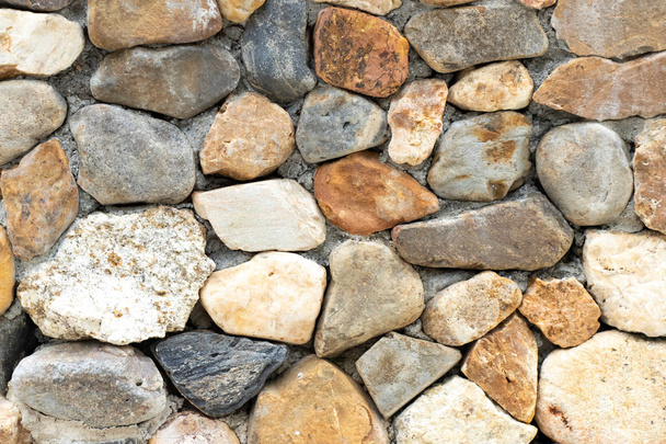 Many size of rock composite to stone wall background - Foto, imagen