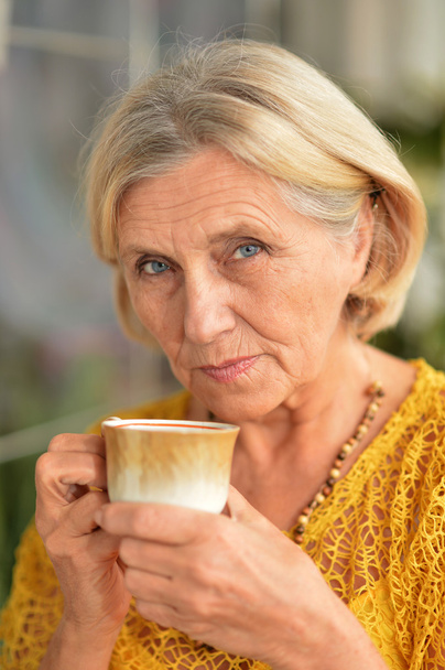cute elderly woman drinking tea - Valokuva, kuva