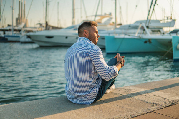 Young rich man at Yacht Club. Businessman is Relaxing - Photo, Image