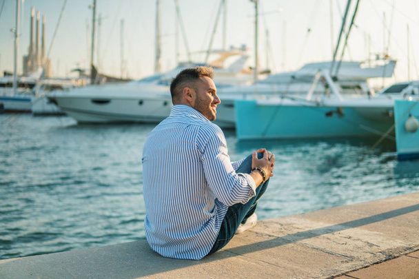 Young rich man at Yacht Club. Businessman is Relaxing - Photo, Image