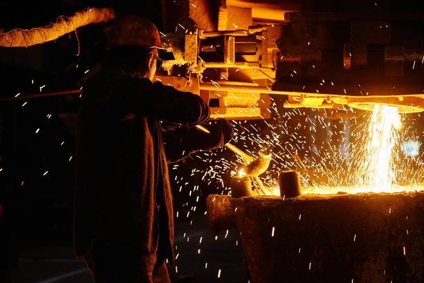 Steelmaker at ingot casting. Electric arc furnace shop EAF. Metallurgy. - Photo, Image
