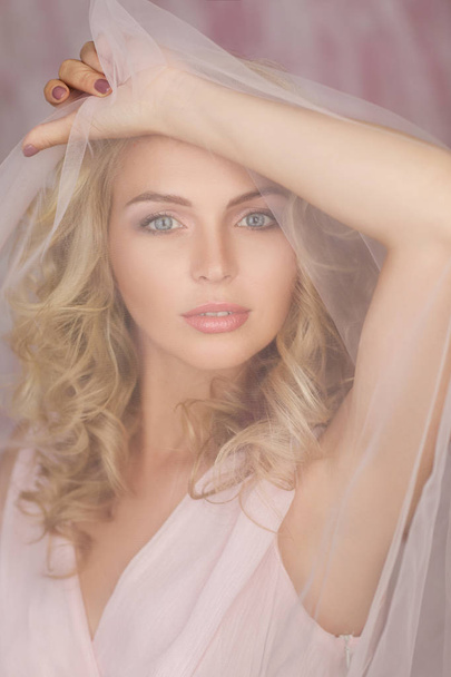 curly blonde woman in gorgeous pink dress - Foto, Imagen
