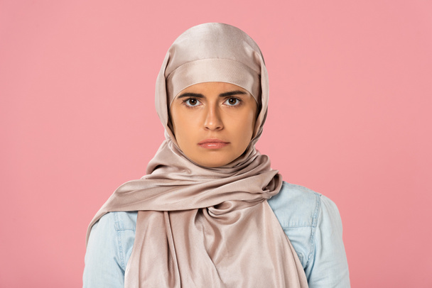 beautiful serious muslim girl in hijab, isolated on pink - Photo, Image