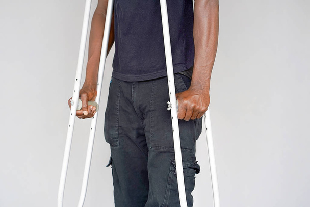 African man with crutch. Close-up. Side view - Фото, зображення
