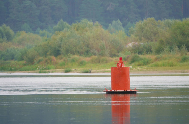 Red buoy - protects underwater obstacles and shows the border of the ship's passage from the right Bank. - Photo, Image