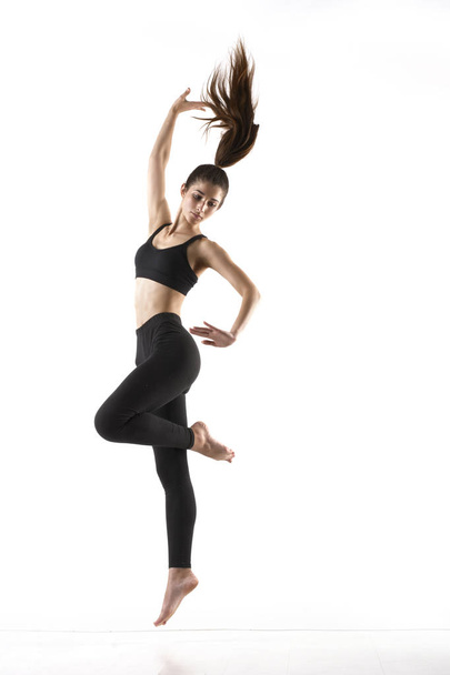 girl doing gymnastic exercises  - Fotó, kép