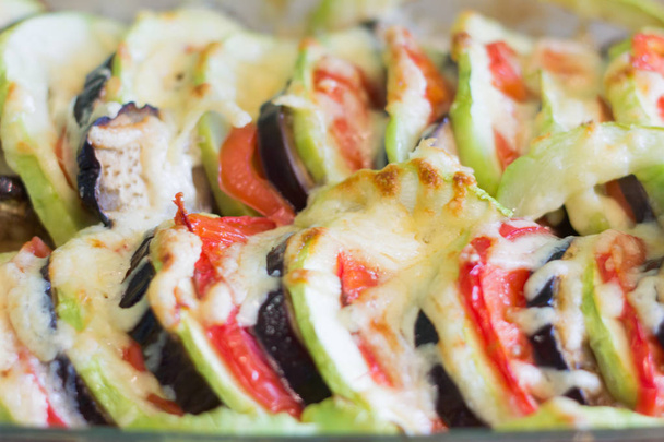 Delicious seasonal vegetables. Eggplant,zucchini and tomato baked with cheese,Ratatouille - Photo, Image