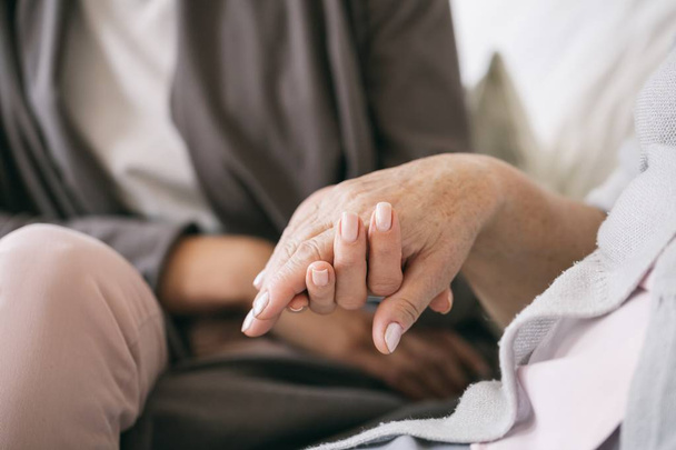 Caregiver holding the hand - Photo, Image
