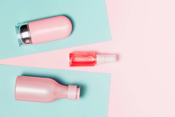 Creative minimal beauty and health background with pink bottle - Fotó, kép