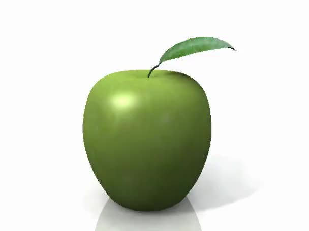 Manzana verde girando sobre sí misma sobre un fondo blanco
 - Metraje, vídeo