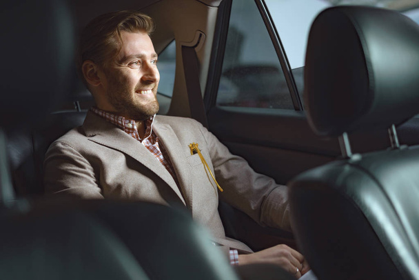 Self-confident man in expensive car - Фото, зображення