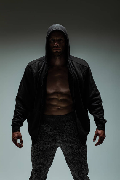 handsome sexy muscular man with naked torso and jacket - 写真・画像