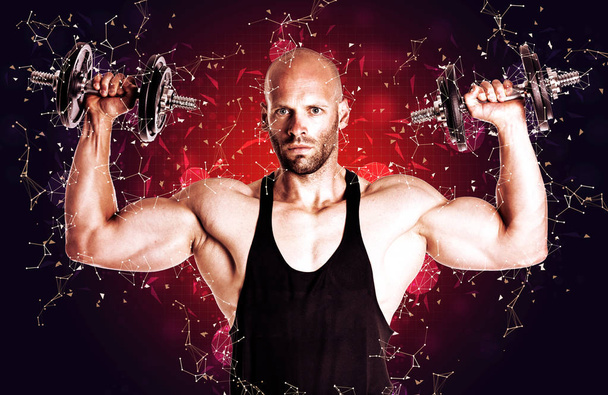 handsome sexy muscular man holding dumbbells on red background - Photo, Image